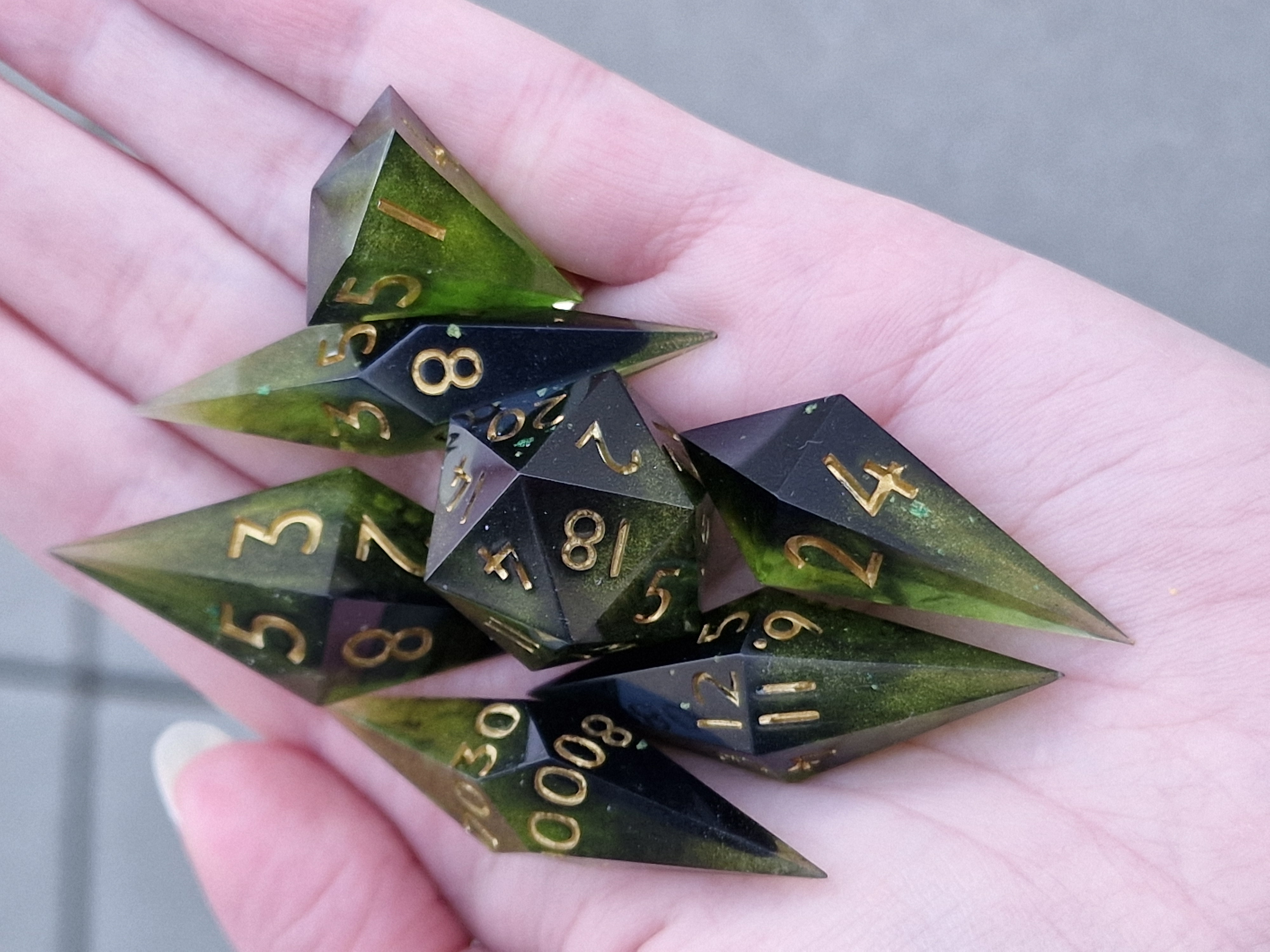 Forest green fades into deep shadow, with golden numbers catching the light.